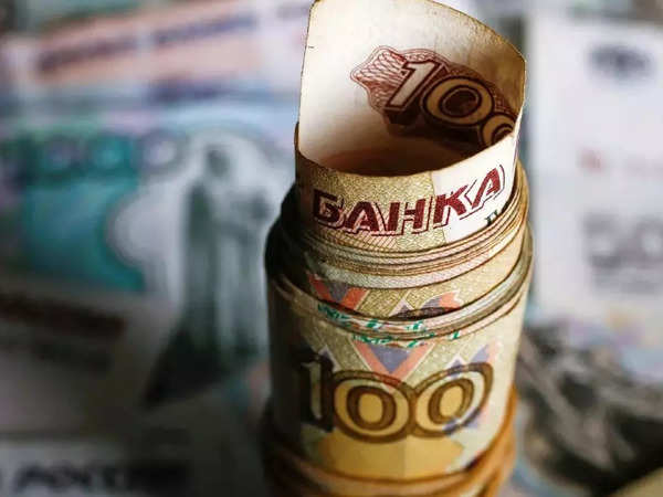 Russian ruble plunges nearly 30% against the dollar amid sanctions over Ukraine invasion