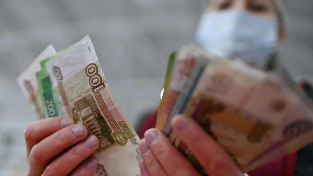 Russian ruble plunges nearly 30% against the dollar amid sanctions over Ukraine invasion