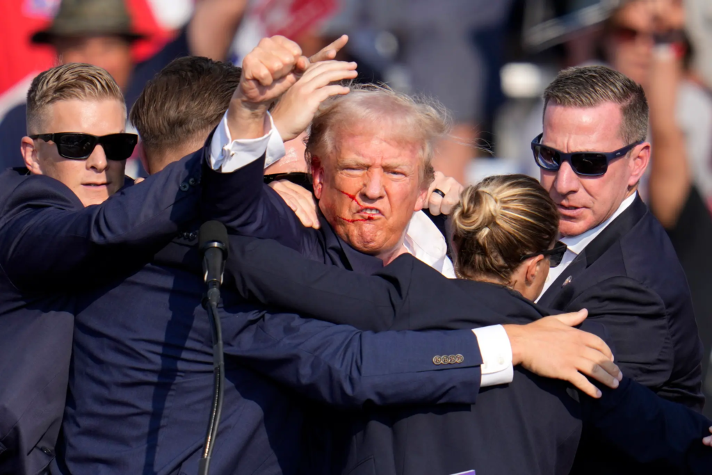 Watch: Trump pumps fist at crowd seconds after apparent assassination attempt