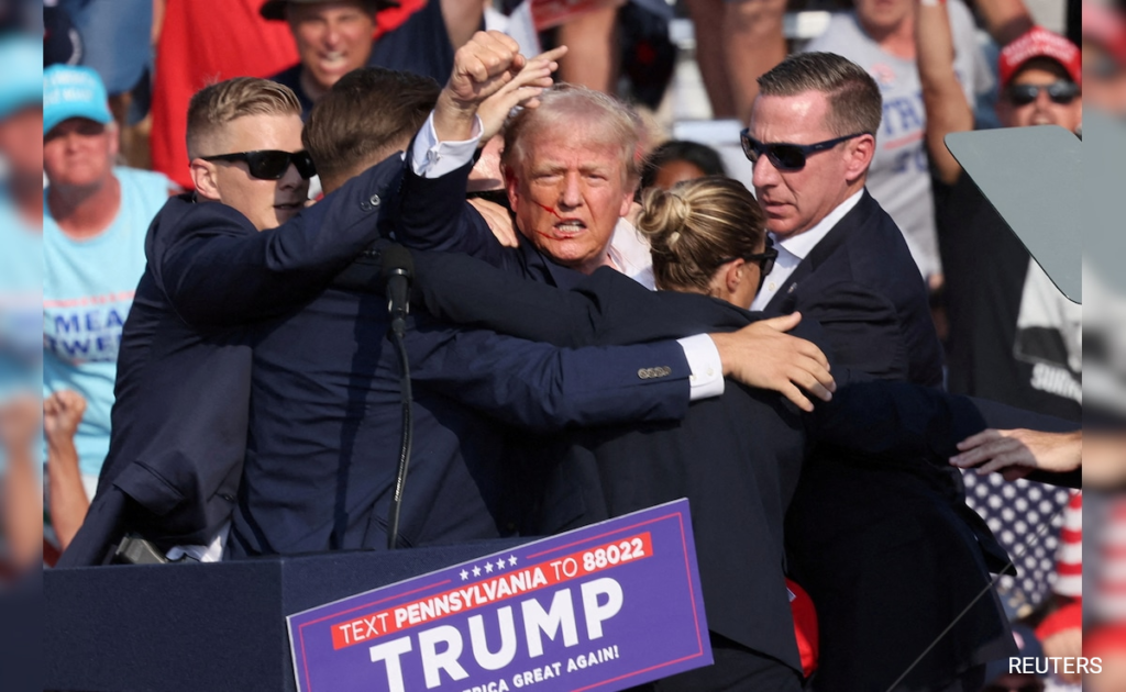 Watch: Woman's "suspicious" behavior during Trump rally shooting sparks controversy