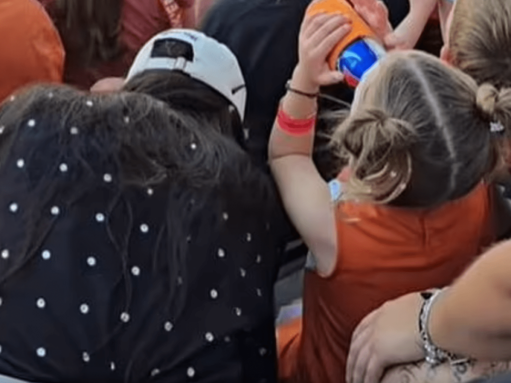 Watch: Toddler spotted drinking beer at University of Texas football game