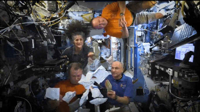 Watch: NASA astronauts celebrate Thanksgiving with a smoked turkey meal in space