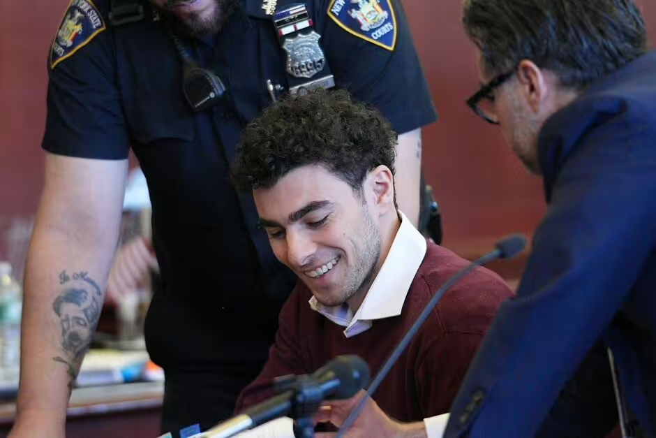 Luigi Mangione smiles in court as he pleads not guilty to murder and terror charges