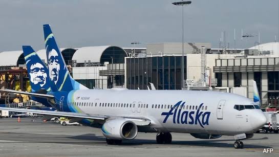 Passenger climbs over wing after opening emergency exit on Alaska Airlines flight