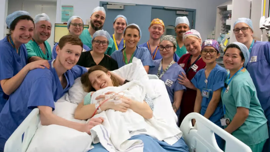 Grace and Angus Davidson with the hospital team at the birth of baby Amy Isabel. Photograph: Womb Transplant UK/PA